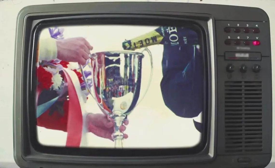 Vintage television showing a trophy, film still